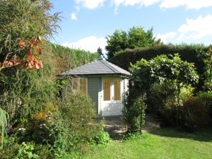 3.0 x 3.0m Weybourne Summerhouse painted in Exterior Lizard & Cream with Grey Slate Effect Tiles