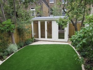 2.4 x 3.6m Burnham Studio with Partition painted in Exterior Sandstone with grey slate effect tiles on the roof