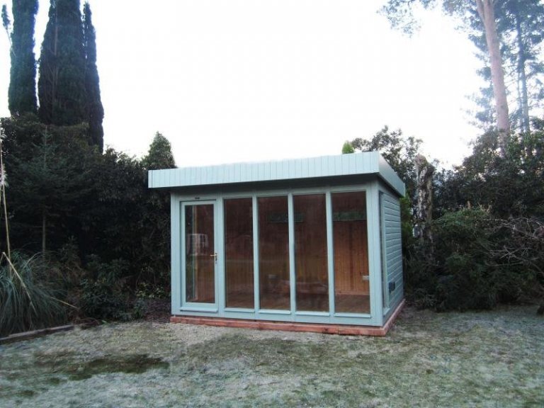 A modern and stylish garden studio with a pent roof and smooth shiplap cladding. The studio has electrics and natural pine lining. 