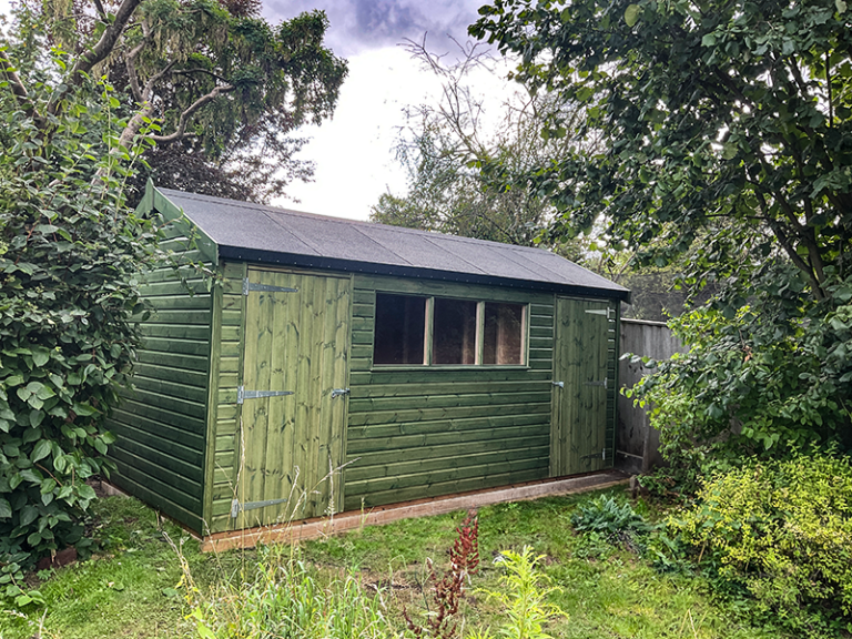 2.4 x 4.8m Superior Shed Treated with Sikkens Green and Two Sets of Doors